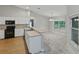 Bright kitchen featuring white cabinets and stainless appliances at 5522 1St Se St, Lakeland, FL 33812