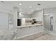 Bright kitchen features white cabinetry, modern appliances, and an open layout at 5522 1St Se St, Lakeland, FL 33812