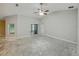 Open living room with sliding glass doors and vaulted ceilings, providing ample natural light and space at 5522 1St Se St, Lakeland, FL 33812