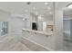 Open concept living space with bar area and stainless refrigerator at 5522 1St Se St, Lakeland, FL 33812