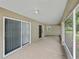 Large covered patio with sliding glass doors, offering seamless indoor-outdoor living at 5522 1St Se St, Lakeland, FL 33812