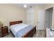Well-lit bedroom with a ceiling fan, closet, and wood-look tile flooring at 6217 Ashley Dr, Lakeland, FL 33813