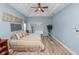Tranquil bedroom with natural light, hardwood floors, and tray ceiling at 6217 Ashley Dr, Lakeland, FL 33813