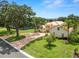 Well-maintained house with a metal roof and lush landscaping in a desirable neighborhood at 6217 Ashley Dr, Lakeland, FL 33813
