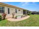 Beautiful exterior featuring a garden, screened-in porch, and a charming brick pathway at 6217 Ashley Dr, Lakeland, FL 33813