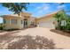 Lovely single-Gathering home with brick driveway, two-car garage, and manicured landscaping at 6217 Ashley Dr, Lakeland, FL 33813