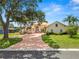 Beautiful single-Gathering home with an inviting brick driveway and well-manicured lawn at 6217 Ashley Dr, Lakeland, FL 33813