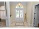 Bright foyer features tile flooring, arched transom window, and a welcoming entryway at 6217 Ashley Dr, Lakeland, FL 33813