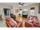 Inviting living room featuring hardwood floors, two sofas, and a ceiling fan at 6217 Ashley Dr, Lakeland, FL 33813