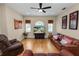 Bright living room with hardwood floors, comfortable seating, and a decorative rug at 6217 Ashley Dr, Lakeland, FL 33813