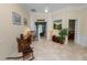 Comfortable living room with tile floors, a decorative plant, and access to an outside patio at 6217 Ashley Dr, Lakeland, FL 33813