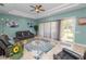 Bright sun room featuring tile flooring, a ceiling fan, and sliding glass doors to the yard at 6217 Ashley Dr, Lakeland, FL 33813