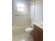 Clean bathroom with a shower-tub combo and classic white tile at 624 Brockton Dr, Kissimmee, FL 34758