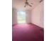 Bright bedroom with a ceiling fan and large window that let's in natural light at 624 Brockton Dr, Kissimmee, FL 34758
