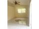 Bedroom with neutral walls, decorative tile, and natural light streaming through the window at 624 Brockton Dr, Kissimmee, FL 34758
