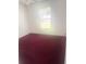 A bedroom has bright natural light from a large window at 624 Brockton Dr, Kissimmee, FL 34758