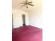 Bedroom showcasing two doors and large closet space, and a ceiling fan at 624 Brockton Dr, Kissimmee, FL 34758