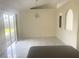 Open-concept dining area with tile floors, light fixture, and sliding glass door to the backyard at 624 Brockton Dr, Kissimmee, FL 34758