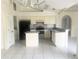 Open kitchen with island and plenty of storage space at 624 Brockton Dr, Kissimmee, FL 34758