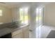 Double sink in the kitchen looks out to a sliding door leading to the backyard at 624 Brockton Dr, Kissimmee, FL 34758