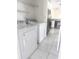 Bright laundry room with appliances conveniently located off of kitchen at 624 Brockton Dr, Kissimmee, FL 34758