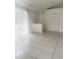 Bright living room with tile flooring and a door leading to the exterior at 624 Brockton Dr, Kissimmee, FL 34758