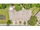 Aerial view of a home showing the roof, landscaping, and proximity to other homes and a water feature at 6365 Torrington Cir, Lakeland, FL 33811