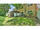 Beautiful backyard with a screened patio, privacy fence, and lush green grass at 6365 Torrington Cir, Lakeland, FL 33811