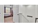 Hallway view into bedroom with carpeted floors and large windows and a door at 6365 Torrington Cir, Lakeland, FL 33811