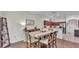 Cozy dining area with a large table, offering seamless access to both the kitchen and living room at 6365 Torrington Cir, Lakeland, FL 33811