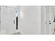 Bright entryway with white front door, sidelight window and views of the stairway to the second floor at 6365 Torrington Cir, Lakeland, FL 33811