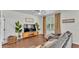 Comfortable living room area featuring a large sectional sofa, hardwood floors and bright windows at 6365 Torrington Cir, Lakeland, FL 33811