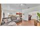 Open-concept living room boasts a comfortable sofa, open access to kitchen, and a separate office space at 6365 Torrington Cir, Lakeland, FL 33811