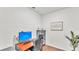 Modern home office features a desk, printer, stylish cabinet, and hard wood floors at 6365 Torrington Cir, Lakeland, FL 33811