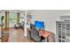 Contemporary office space open to living room with desk, computer, and cabinet at 6365 Torrington Cir, Lakeland, FL 33811