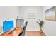 Modern home office features a desk, printer, stylish cabinet, and hard wood floors at 6365 Torrington Cir, Lakeland, FL 33811