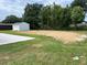 The expansive backyard has a shed and concrete patio, offering a private retreat at 6507 Shadowbrook Run, Lakeland, FL 33813