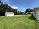 The lush backyard has a shed and playground, providing plenty of room for recreation at 6507 Shadowbrook Run, Lakeland, FL 33813