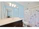 Bathroom featuring a vanity with modern fixtures and a shower at 6507 Shadowbrook Run, Lakeland, FL 33813