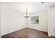Cozy dining area with chandelier and window for natural light at 6507 Shadowbrook Run, Lakeland, FL 33813