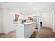 Bright, updated kitchen features white cabinets, stainless steel appliances, and a butcher block island at 6507 Shadowbrook Run, Lakeland, FL 33813