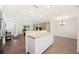 Spacious kitchen features a functional island with butcher block countertop and white cabinetry at 6507 Shadowbrook Run, Lakeland, FL 33813