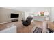 Inviting living space seamlessly connects to a modern kitchen, featuring comfortable seating and natural light at 6507 Shadowbrook Run, Lakeland, FL 33813