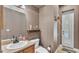 Well-decorated bathroom with modern fixtures, a sleek vanity, and a door to outside at 6757 High Grove Dr, Lakeland, FL 33813