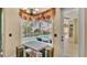 Cozy breakfast nook with pool view, chandelier, bench seating, and easy access to the patio at 6757 High Grove Dr, Lakeland, FL 33813