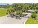 Gated community entrance with mature trees and manicured landscaping at 6757 High Grove Dr, Lakeland, FL 33813