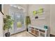 Bright foyer with decorative front door, tile floor, and storage console at 6757 High Grove Dr, Lakeland, FL 33813