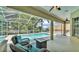 Relaxing screened-in pool area with comfortable seating and a stylish patio at 6757 High Grove Dr, Lakeland, FL 33813