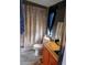 Compact bathroom featuring a shower-tub combo, vanity, and vibrant shower curtain at 6915 Dove Meadow Trl, Lakeland, FL 33810