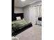 Serene bedroom with a plush bed, soft carpeting, and elegant window curtains at 6915 Dove Meadow Trl, Lakeland, FL 33810